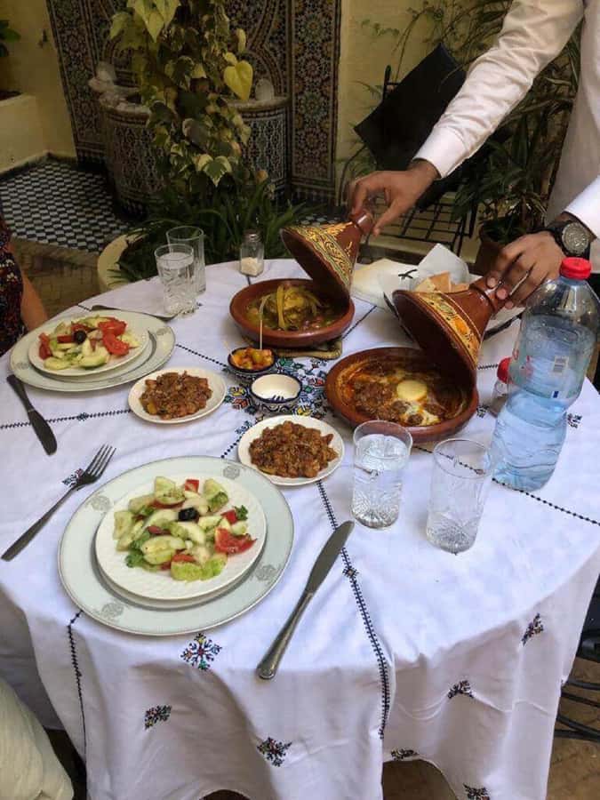Fes: Authentic Cooking Class and Old Medina Visit - Sitting down to eat what you prepared