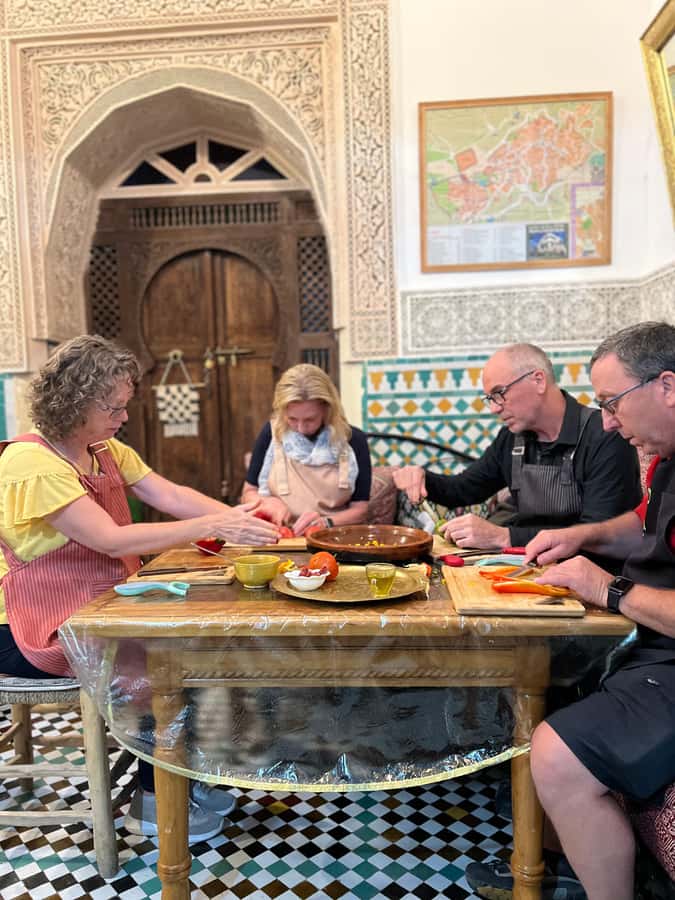 Fez: Souk Tour and Traditional Home Cooking Class - Cooking together in a Fessi family home