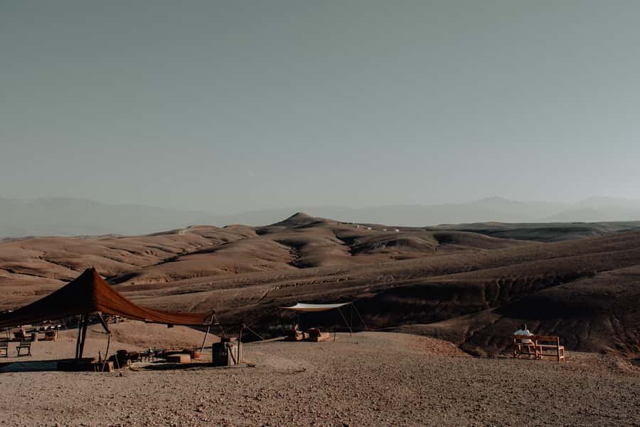From Marrakech: Agafay Desert Sunset, Camel Ride, and Dinner - Moroccan dinner beside the campfire