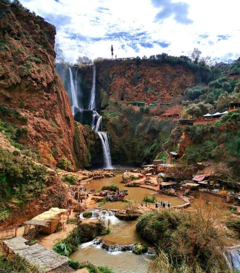 From Marrakech:Ouzoud Waterfalls Day Trip with Boat Tour - First views of the red cliffs and olive groves