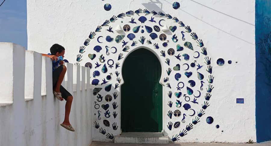 From Tangier: Asilah Day Trip with Cap Spartel & Camel Ride - Leaving Tangier through Rmilat Park