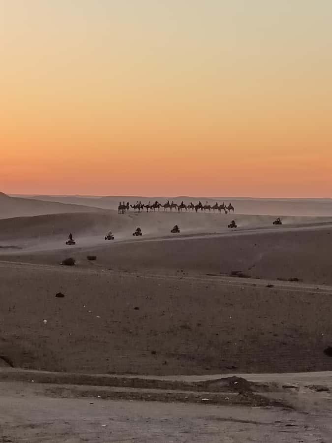 Marrakech: Agafay Desert Quad & Camel Rides with Dinner Show - Sunset over the rocky desert