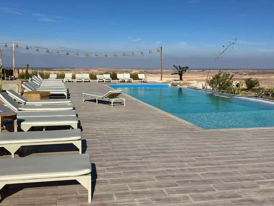 Marrakech: Agafay Dinner Show with Quad/Camel Ride and Pool - Golden-hour views across rocky terrain