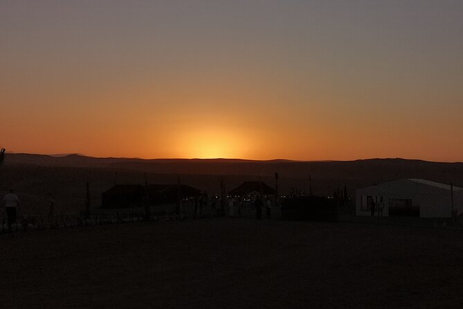 Marrakech: Camels & Quads on Sunset and Luxury Dinner with Show - Sunset at camp, with a practical warning about timing