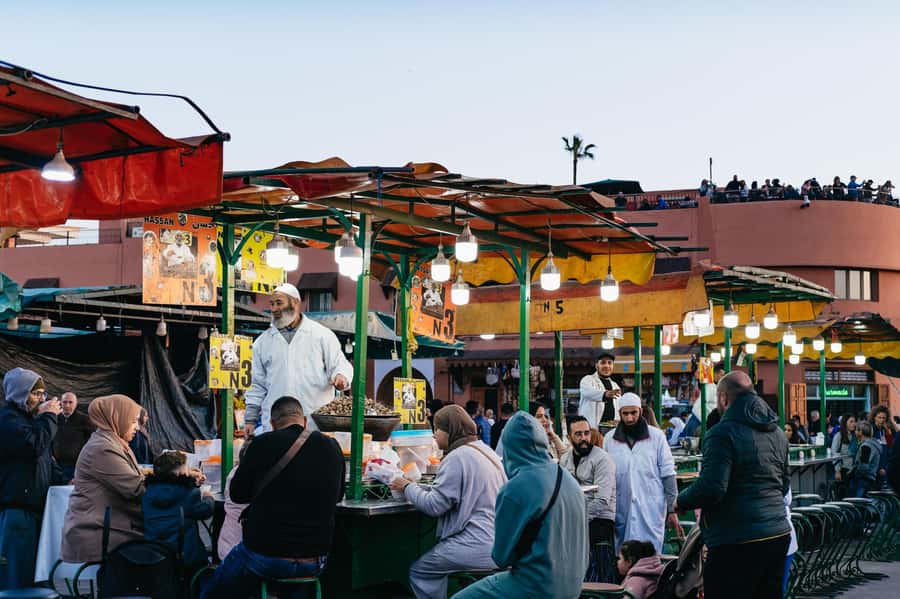 Marrakech: Medina by Night Walking Tour with Moroccan Tea - The rooftop tea finish