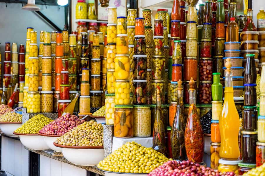 Marrakech: Monuments, Souks and Medina Guided Walking Tour - The souks, from leather and clothing to herbs and perfume