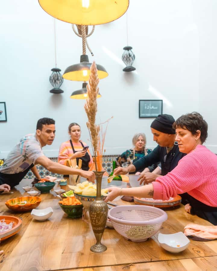 Moroccan Food Cooking Class with a Local Chef in Marrakech - Cutting, peeling, and seasoning the tagine