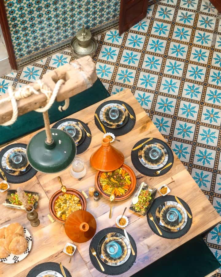 Moroccan Food Cooking Class with a Local Chef in Marrakech - Sitting down to eat what you prepared